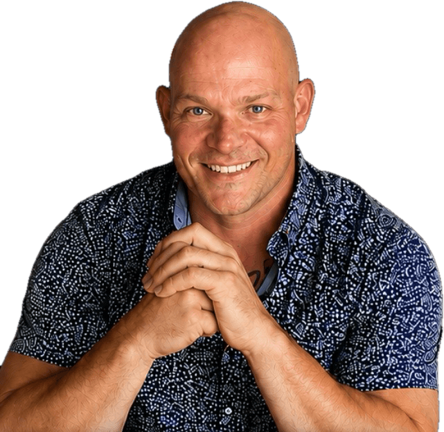 Dan Perkins, Subaru of Utica sales consultant, smiling with hands clasped